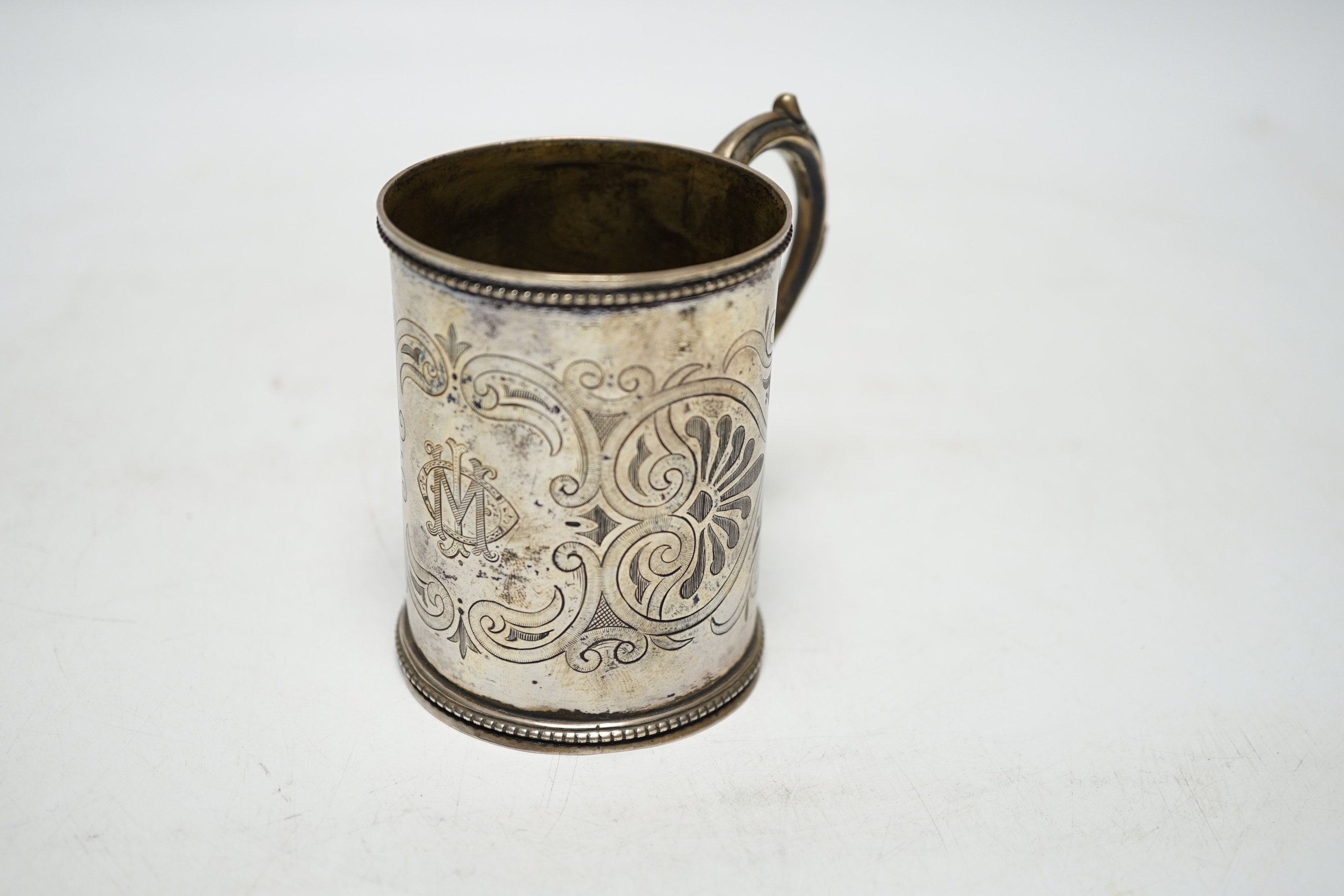 A Victorian engraved silver christening mug, Henry Holland, London, 1866, 87mm, 117 grams.